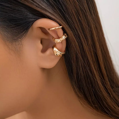 Three-piece vintage clip-on ear cuff set for women, non-piercing design.
Close-up of vintage-inspired non-piercing ear cuffs with delicate detailing.
Woman wearing trendy, non-piercing clip-on ear cuffs in a stylish arrangement.
Side view of the clip-on ear cuff set showcasing vintage and creative design.
Non-piercing ear cuff jewelry set displayed on a jewelry stand, ideal for gifting.