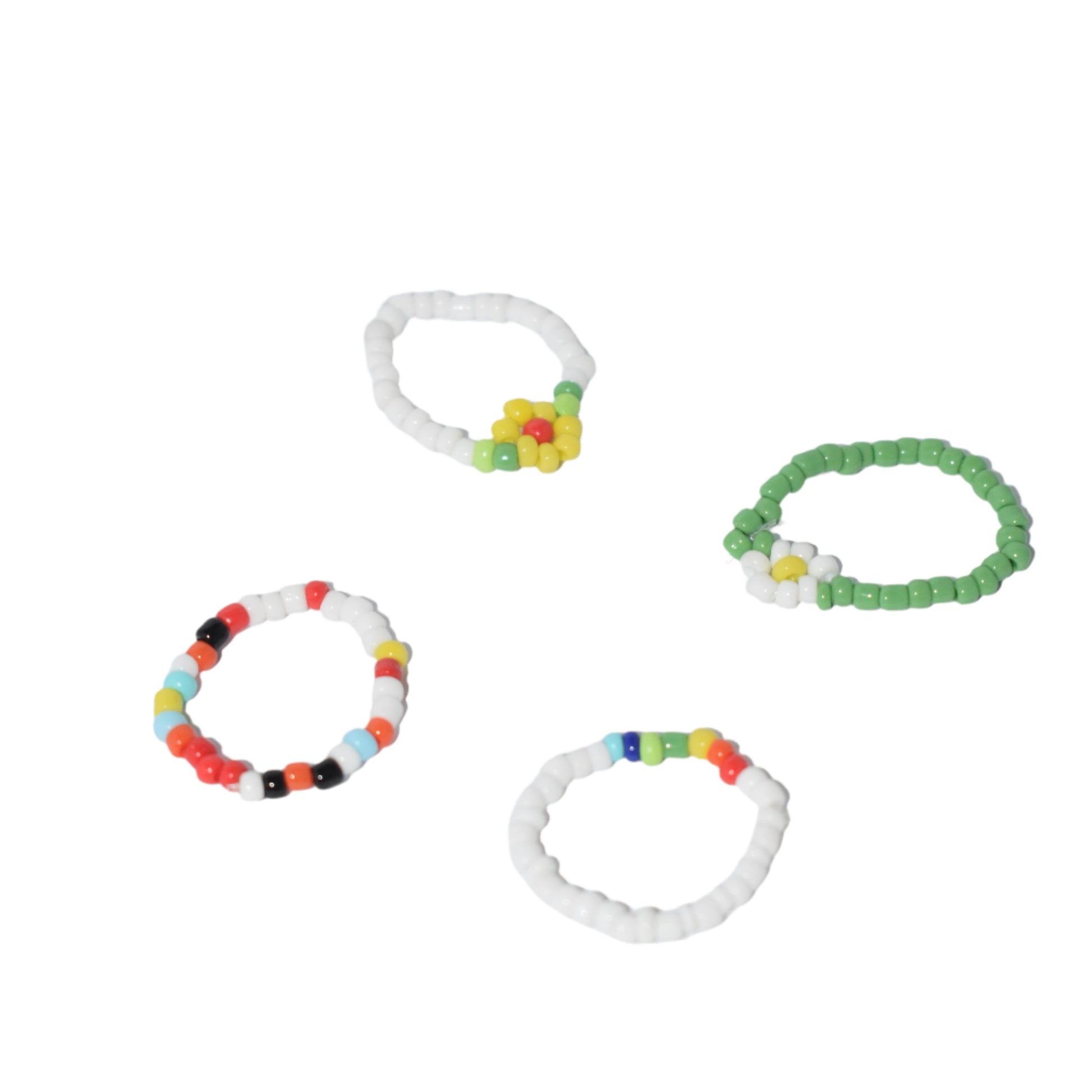 "Set of 4 Bohemian daisy flower beaded rings with colorful resin and acrylic beads."
"Close-up of 4 hand-woven elastic rings featuring daisy flower accents and colorful beads."
"Boho-chic set of 4 beaded rings with daisy flowers, made of resin and acrylic."
"Colorful elastic beaded rings set with daisy flower design, perfect for bohemian style."
"Set of 4 vibrant bohemian rings featuring daisy flowers, made from colorful resin and acrylic beads."