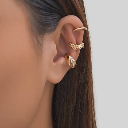 Three-piece vintage clip-on ear cuff set for women, non-piercing design.
Close-up of vintage-inspired non-piercing ear cuffs with delicate detailing.
Woman wearing trendy, non-piercing clip-on ear cuffs in a stylish arrangement.
Side view of the clip-on ear cuff set showcasing vintage and creative design.
Non-piercing ear cuff jewelry set displayed on a jewelry stand, ideal for gifting.