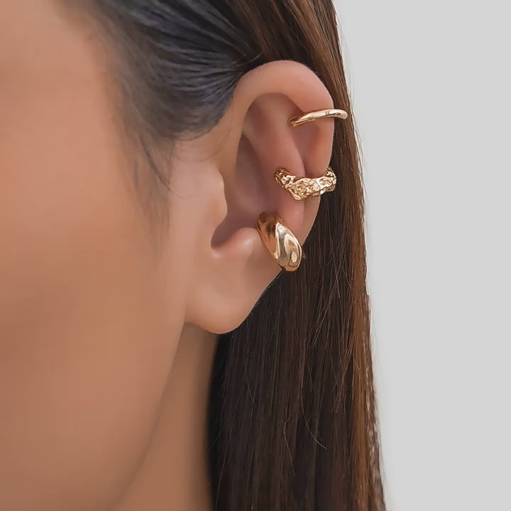 Three-piece vintage clip-on ear cuff set for women, non-piercing design.
Close-up of vintage-inspired non-piercing ear cuffs with delicate detailing.
Woman wearing trendy, non-piercing clip-on ear cuffs in a stylish arrangement.
Side view of the clip-on ear cuff set showcasing vintage and creative design.
Non-piercing ear cuff jewelry set displayed on a jewelry stand, ideal for gifting.